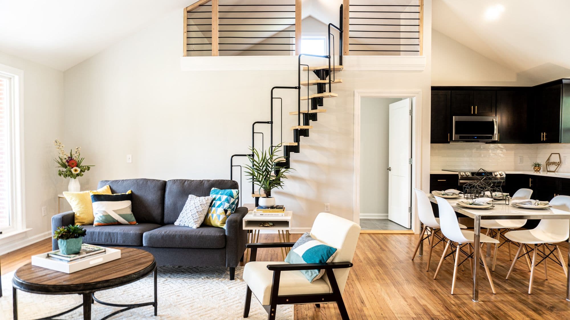 A bright, modern Nashville property interior with open-plan living space and hardwood floors